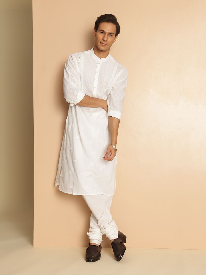 Lifestyle view of white Chikankari kurta styled for a relaxed ethnic look with minimal accessories