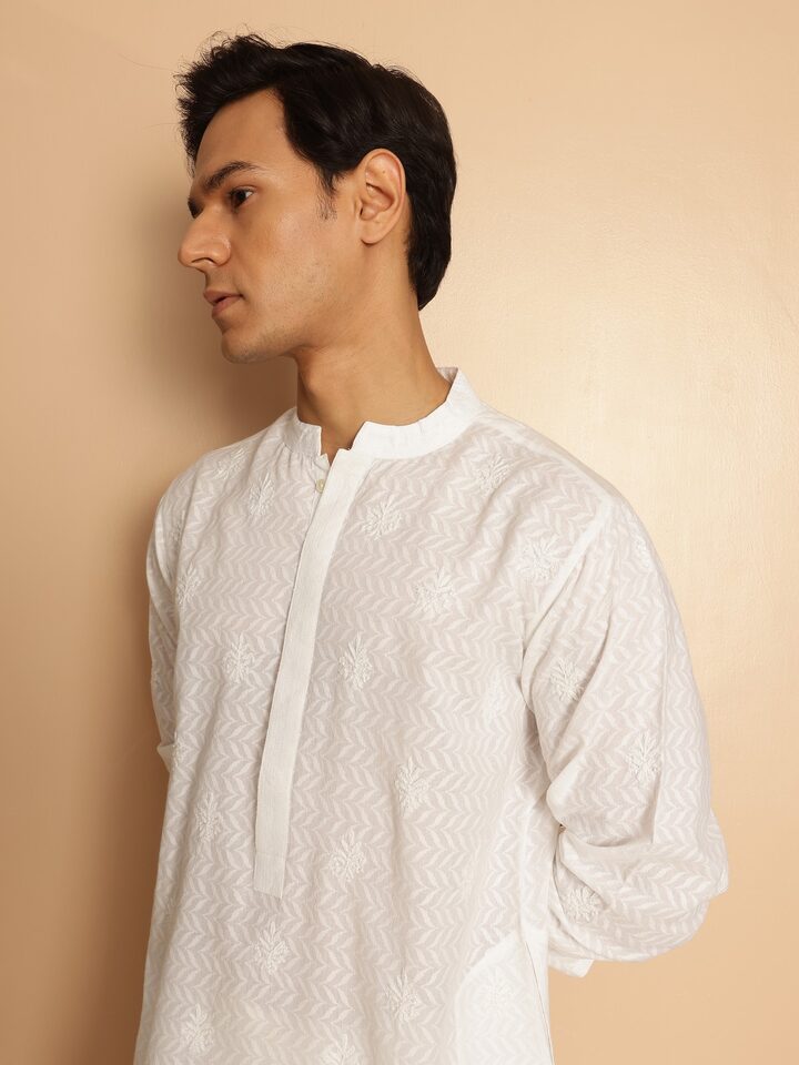 Another angle capturing the delicate hand embroidery and fine stitch details that define this piece.
