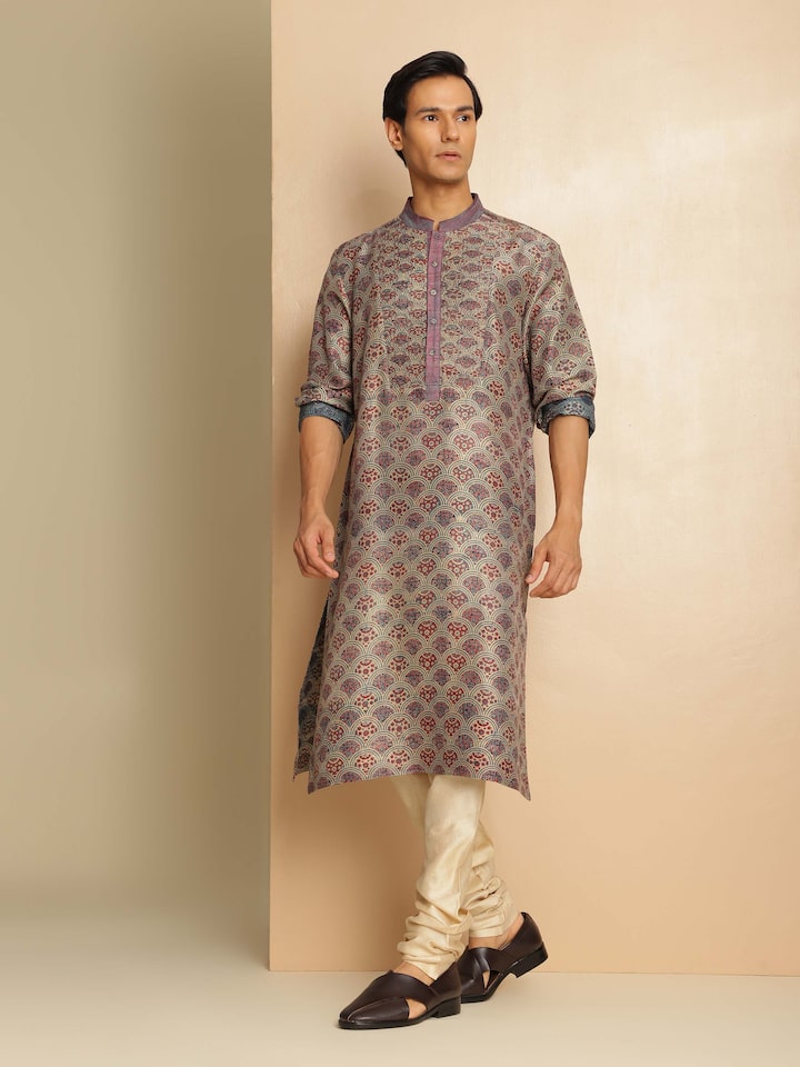 Lifestyle view of Ajrakh printed indigo silk kurta styled with black pants and silver earrings