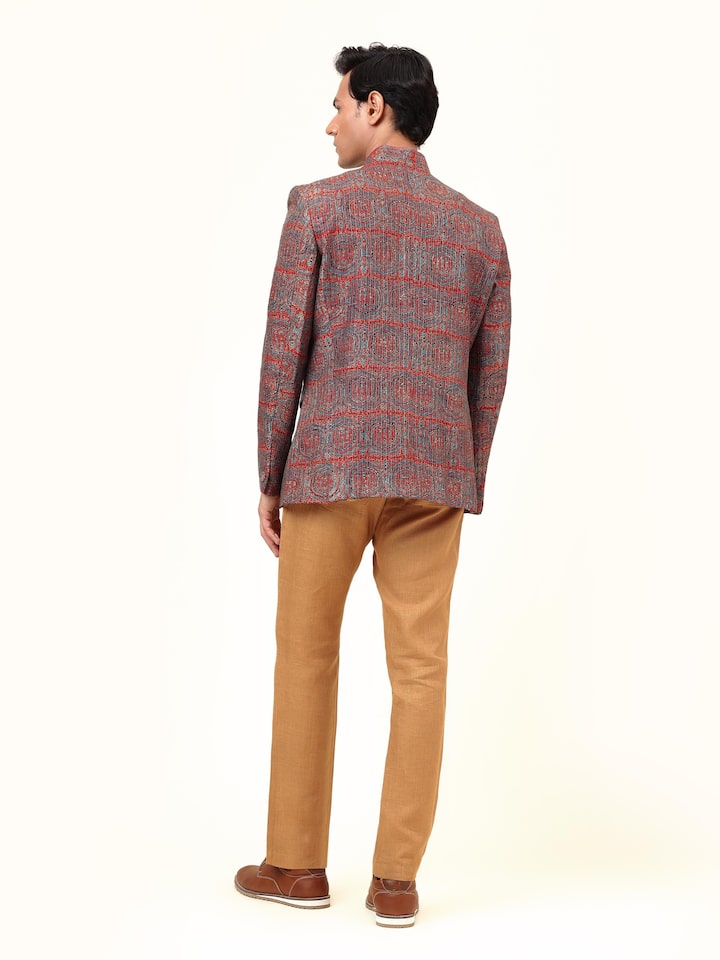 Back view of indigo silk Ajrakh Bandhgala jacket revealing structured tailoring and print continuity