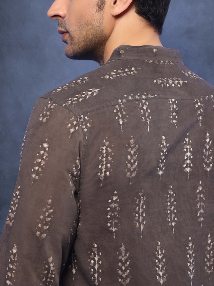 Angled view highlighting kurta’s print and sleeve detail.