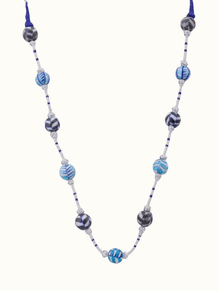 Front view of blue pottery long necklace featuring vibrant blue pottery and intricate design.