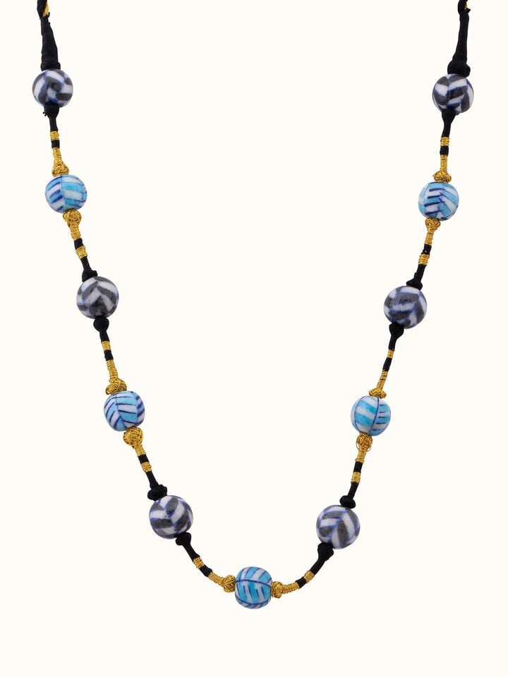 Front view of blue pottery long necklace featuring natural blue pottery stones and elegant design.