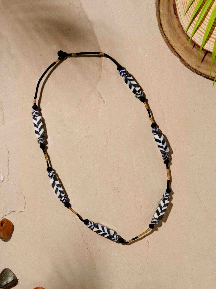Close-up view of Blue pottery long necklace focusing on its detailed ceramic design and artistic finish