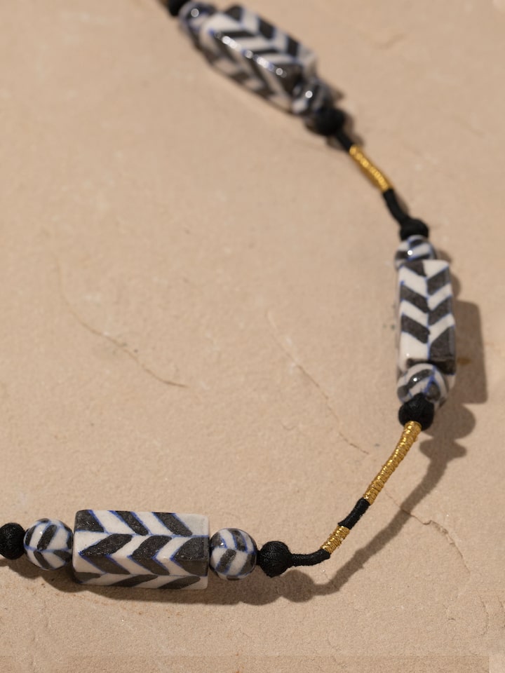 Detailed front view of Blue pottery long necklace highlighting its elegant design and vibrant blue ceramic