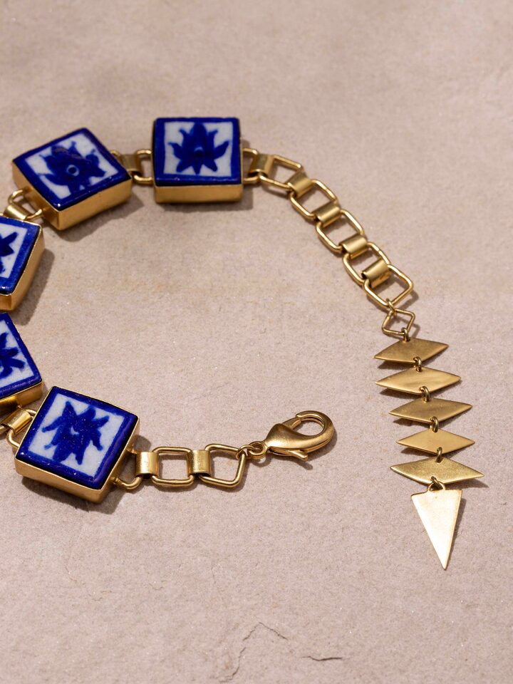 Angled view of Blue Pottery Flexible Bracelet emphasizing ceramic craftsmanship.