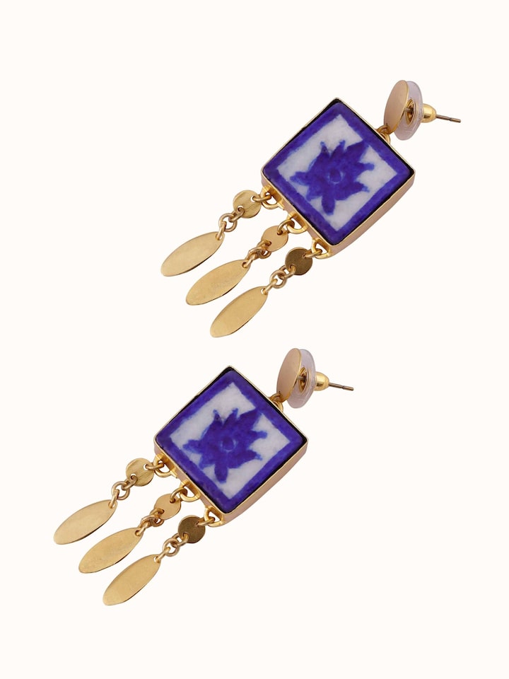 Overhead view of blue pottery drop earrings displaying their full design and vibrant colors.