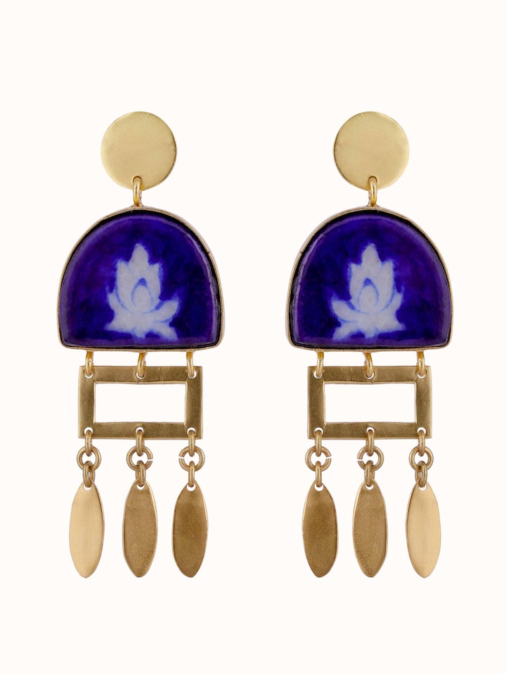 Overhead view of Blue Pottery Drop Earrings showcasing intricate blue and white ceramic design.