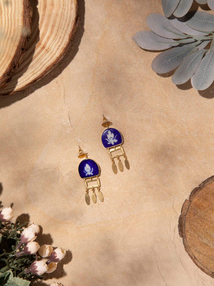Close-up of Blue Pottery Drop Earrings featuring detailed floral patterns in blue pottery style.
