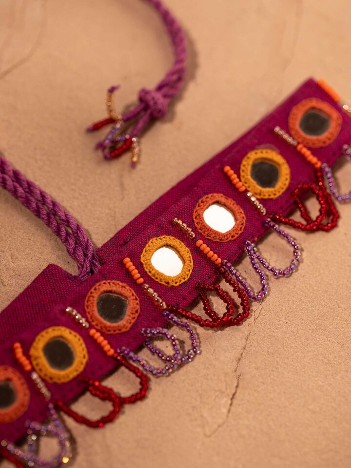 Back view of Lambani Choker highlighting the clasp and detailed embroidery.