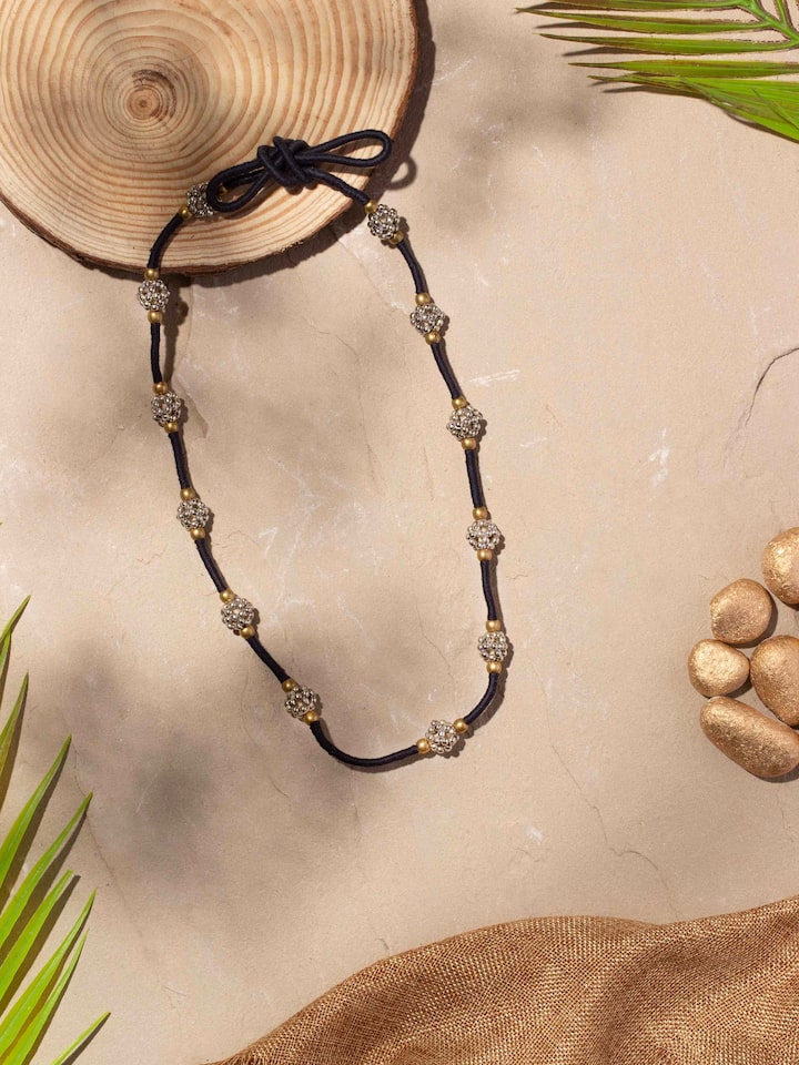 Close-up view of Lambani long necklace emphasizing the intricate beadwork and traditional patterns.