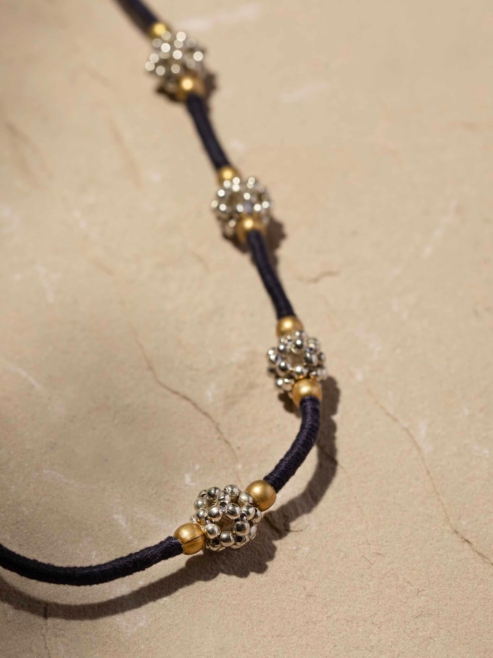 Detailed close-up of Lambani long necklace showcasing the texture and beadwork in the design.