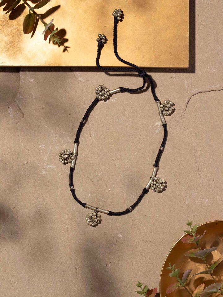 Side view of Lambani Collar Necklace displaying the full length and intricate design elements.