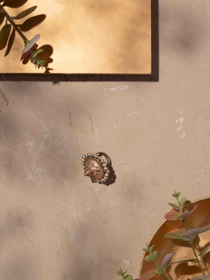 Close-up view of Lambani Ring revealing intricate metal details and colorful embellishments.