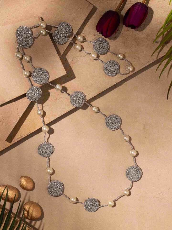 Close-up view of Crochet Long Necklace focusing on detailed crochet pattern.