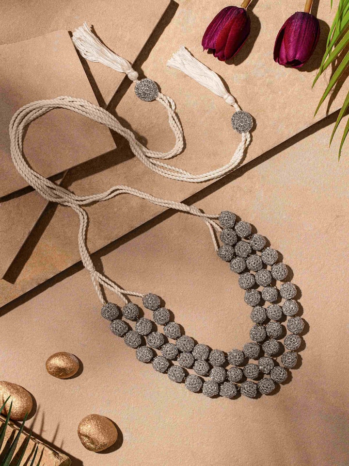 Side view of Crochet Long Necklace, highlighting detailed work