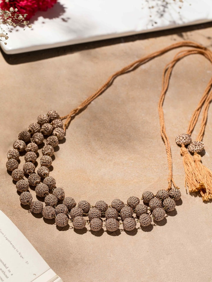 Close-up view of Crochet Long Necklace highlighting fine crochet work and pattern.