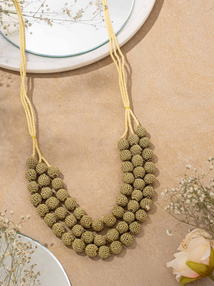 Side view of Crochet Long Necklace highlighting the intricate crochet work and length.