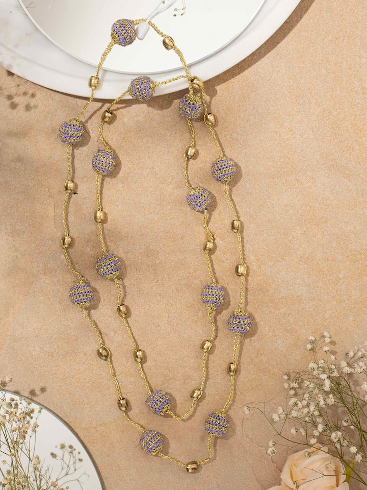 Styled detail view of Crochet Long Necklace worn around the neck, shown in an alternate styled shot