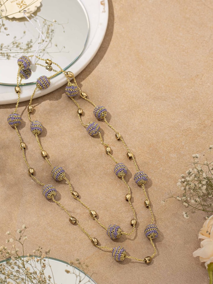 Detail view of Crochet Long Necklace highlighting the stone setting and metalwork detail