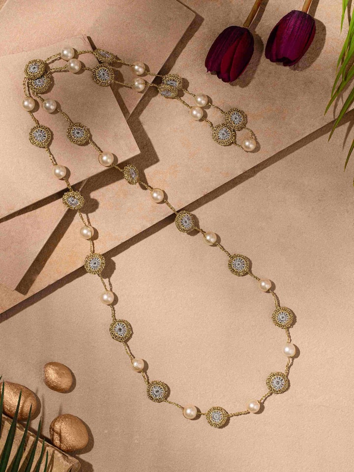 Close-up view of crochet long necklace highlighting the detailed crochet patterns.