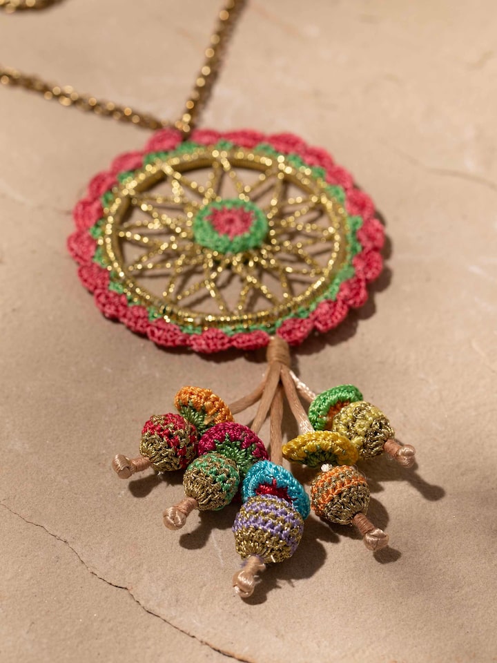 Detail view of Crochet Pendant & Chain highlighting the stone setting and metalwork detail