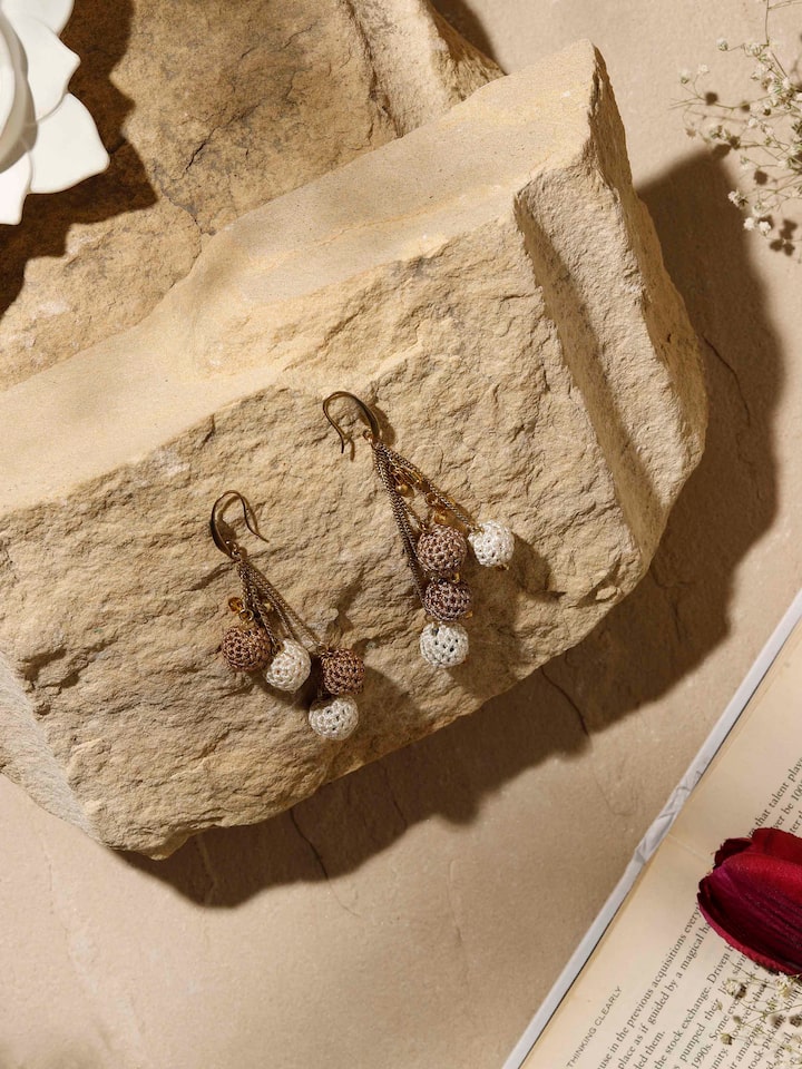 Side view of Crochet Drop Earrings displaying the unique crochet design and drop length.