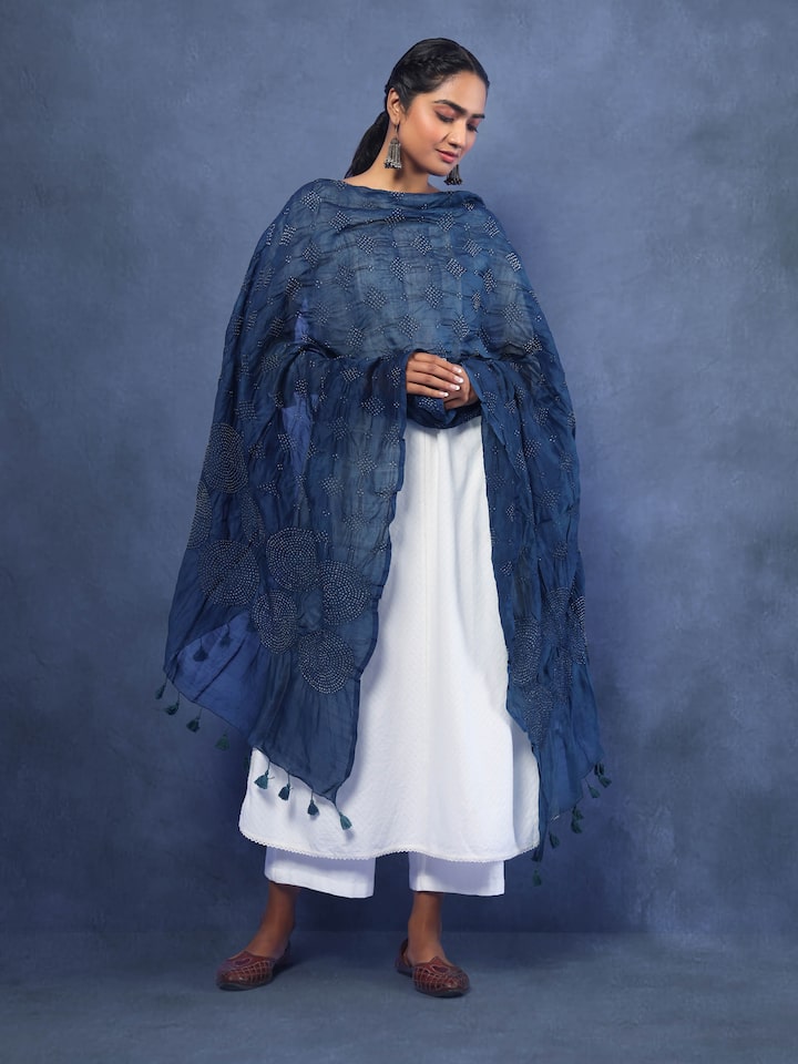 Model wearing indigo Bandhani cotton dupatta, styled over ethnic attire, showing the vibrant tie-dye design.