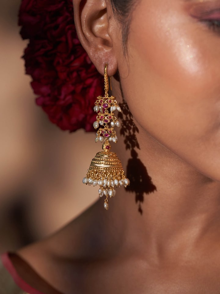 Side view displaying the shape and traditional drop style of the earrings