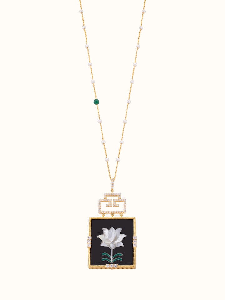 Front view of Pacchikari silver pendant & chain featuring detailed silverwork and elegant design.