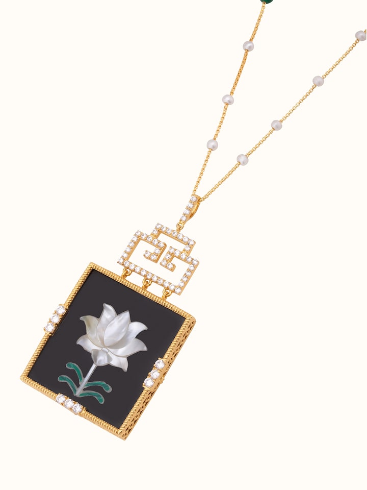 Detailed view of Pacchikari silver pendant & chain focusing on the craftsmanship and intricate design.