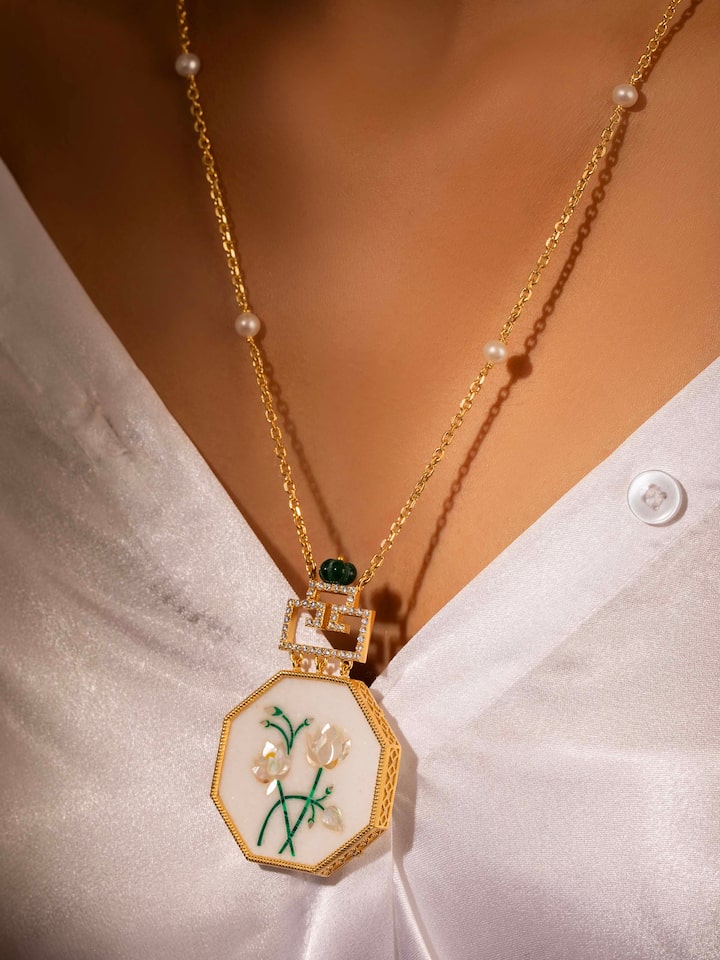 Alternate lifestyle shot capturing pendant details in natural lighting