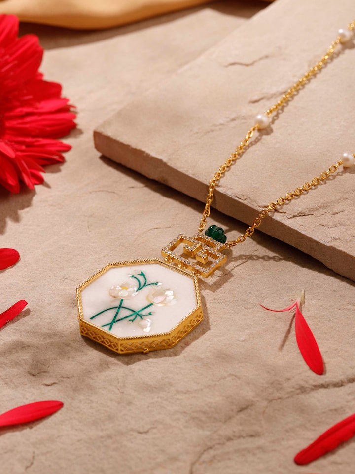 Overhead view of pendant and chain showing symmetrical design