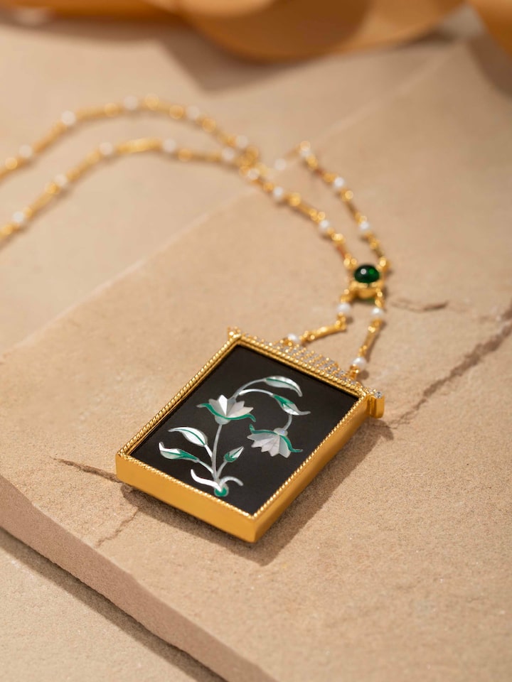 Back view of Pacchikari silver pendant and chain showing the secure clasp and overall design.