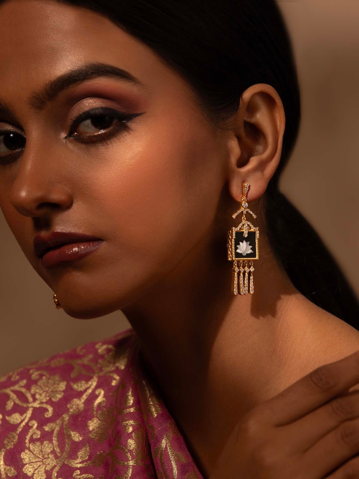 Lifestyle view of Parchinkari drop earrings paired with ethnic wear, reflecting Mughal-inspired style.