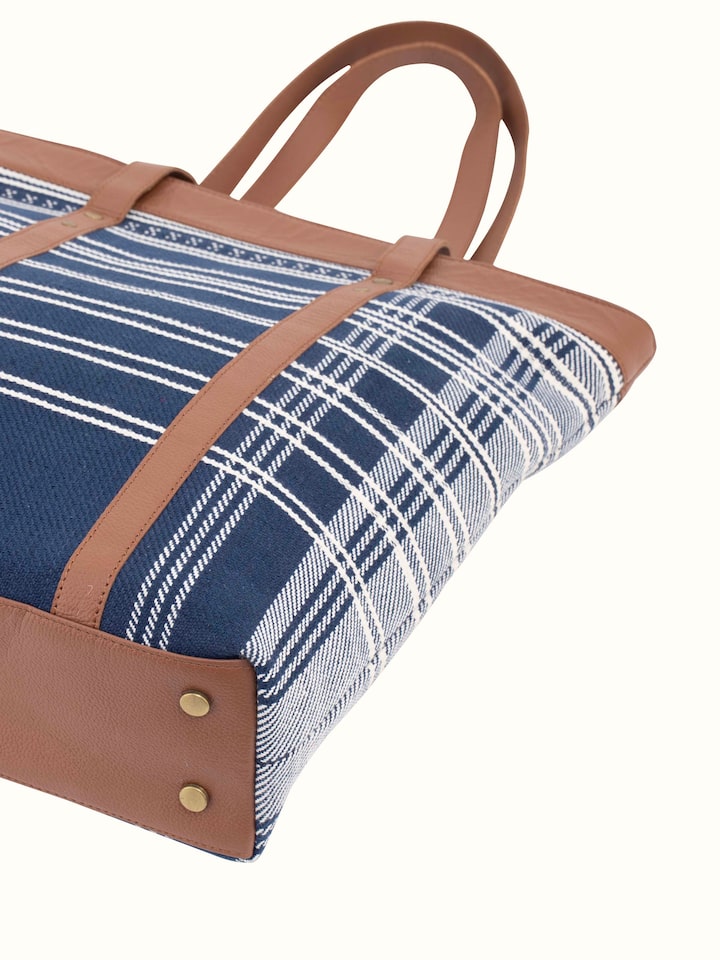 Angled view of Leather & Textile Extra-Weft Tote Bag displaying its practical design and features.