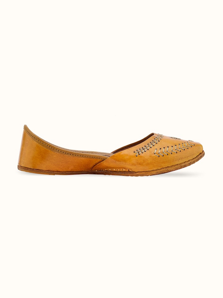 Back view of mustard leather Haryana juttis displaying the overall design and craftsmanship