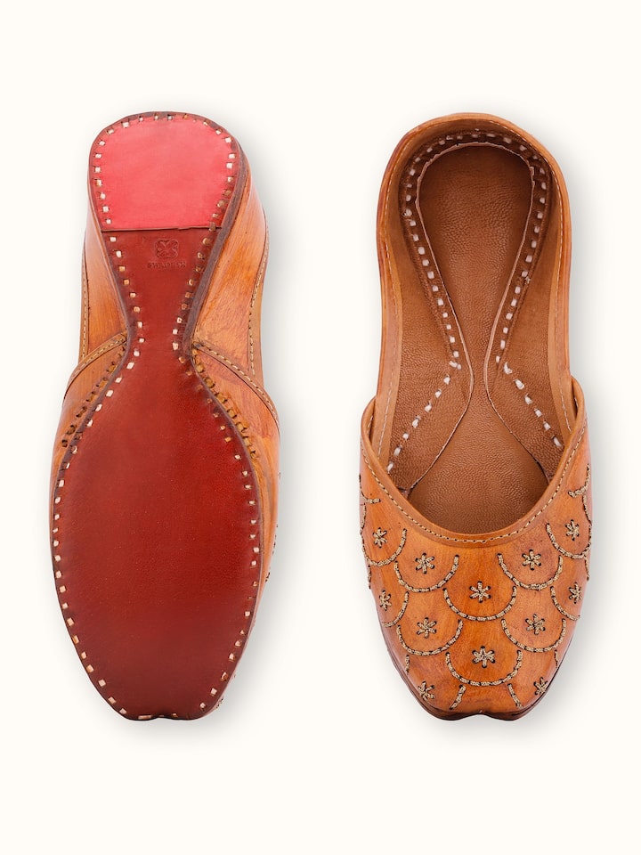 Top view of Mustard Leather Haryana Juttis highlighting the sole and decorative stitching.