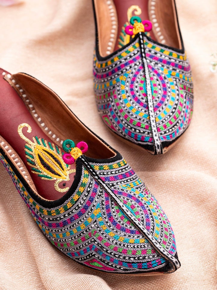 Close-up of Tan Leather Jodhpuri Mules focusing on the leather texture and design elements.