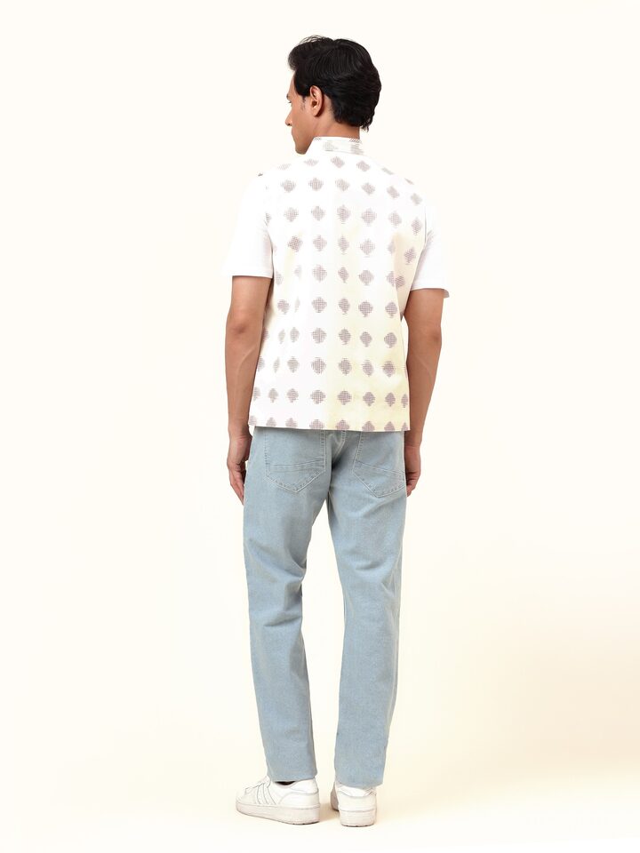 Back view of white Telangana Ikat jacket highlighting precise alignment of handwoven design