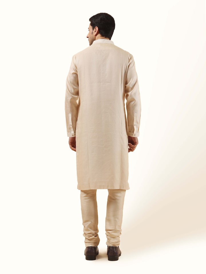 Back view of light beige Tussar silk kurta showing clean tailoring and elegant fall.