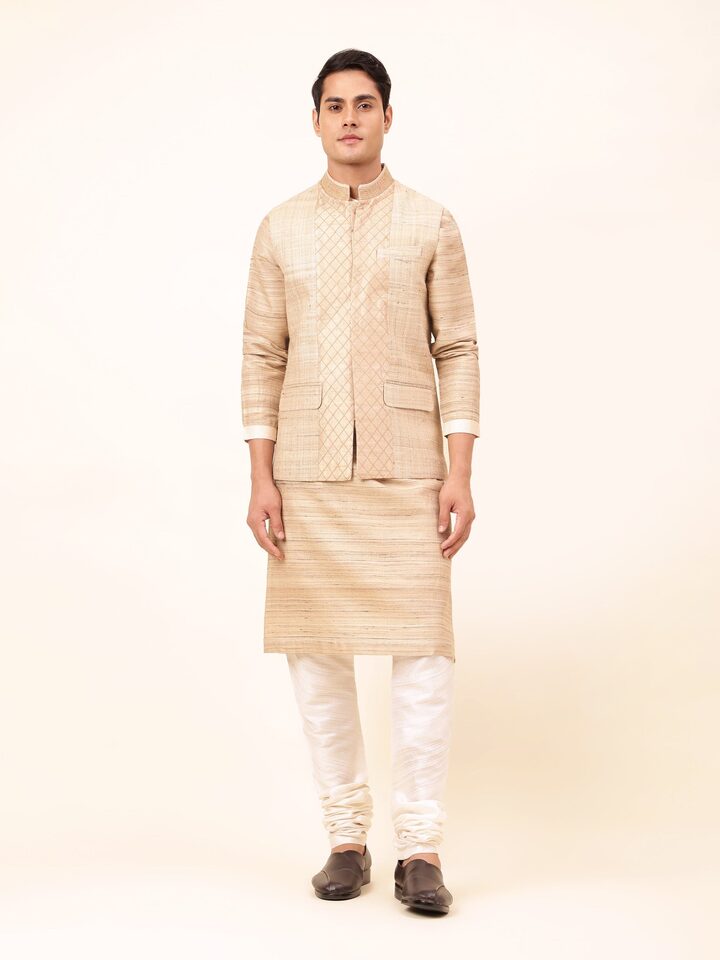 Front view of beige Tussar silk sleeveless jacket featuring subtle sheen and traditional fabric.