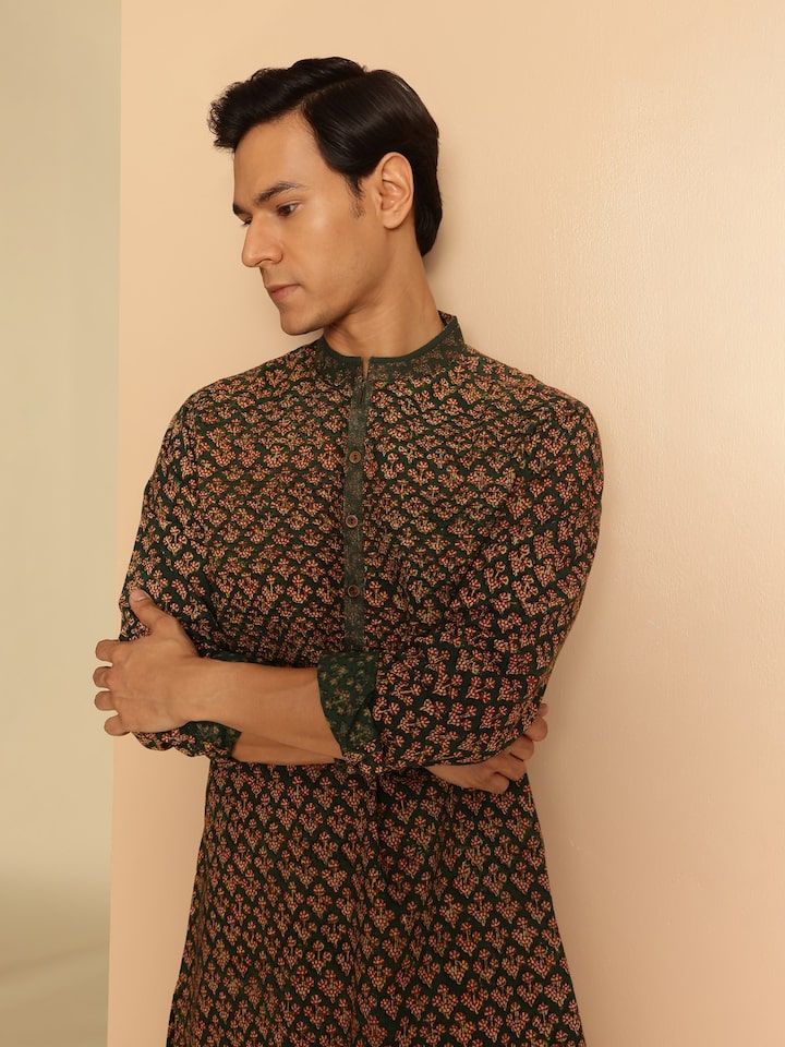 Side profile showing the flattering long silhouette and timeless style of this statement piece.