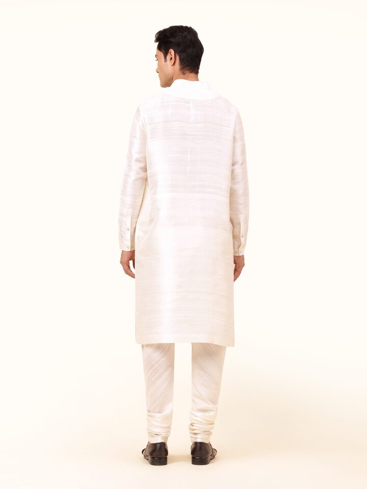 Back view of off-white silk long kurta showcasing clean tailoring and silk texture