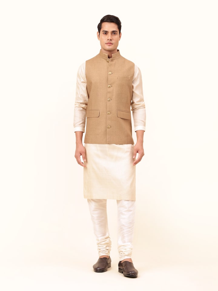 Front view of brown Tussar silk sleeveless jacket with side buttons and collar