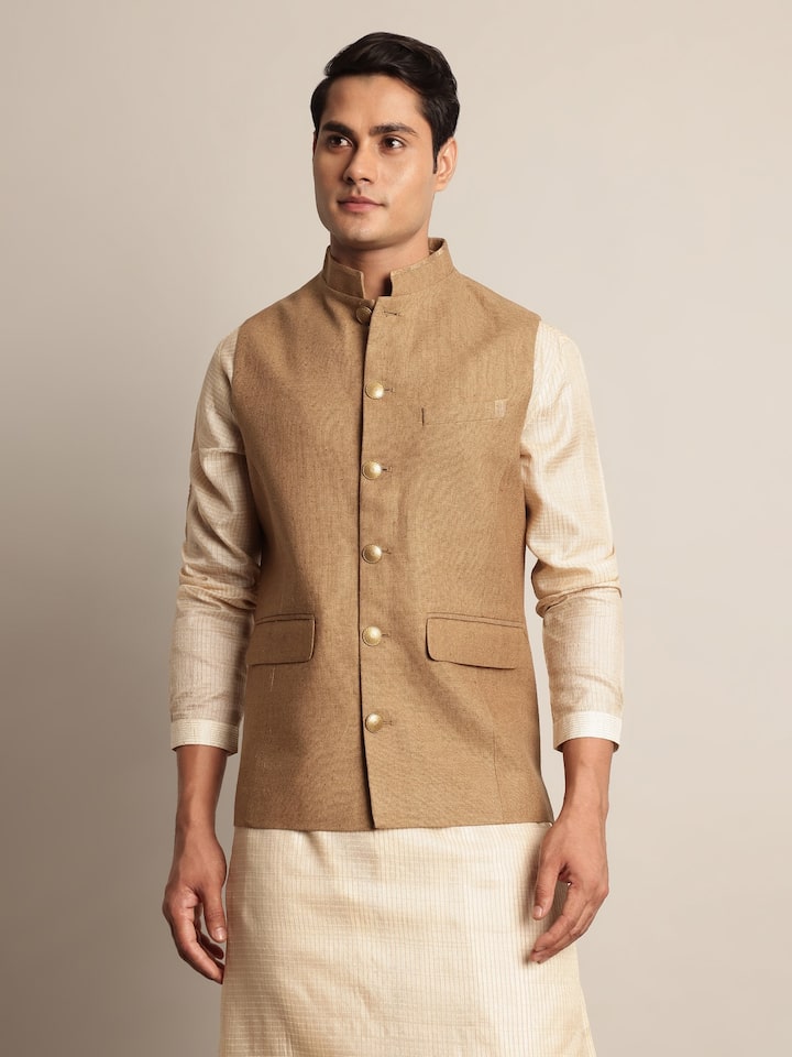 Second lifestyle view showing sleeveless silhouette and texture of jacket