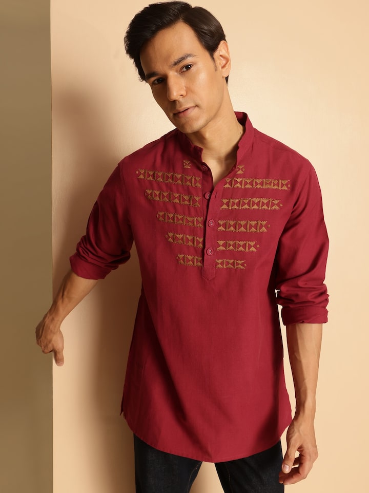 Angled view of maroon cotton embroidered kurta highlighting intricate embroidery