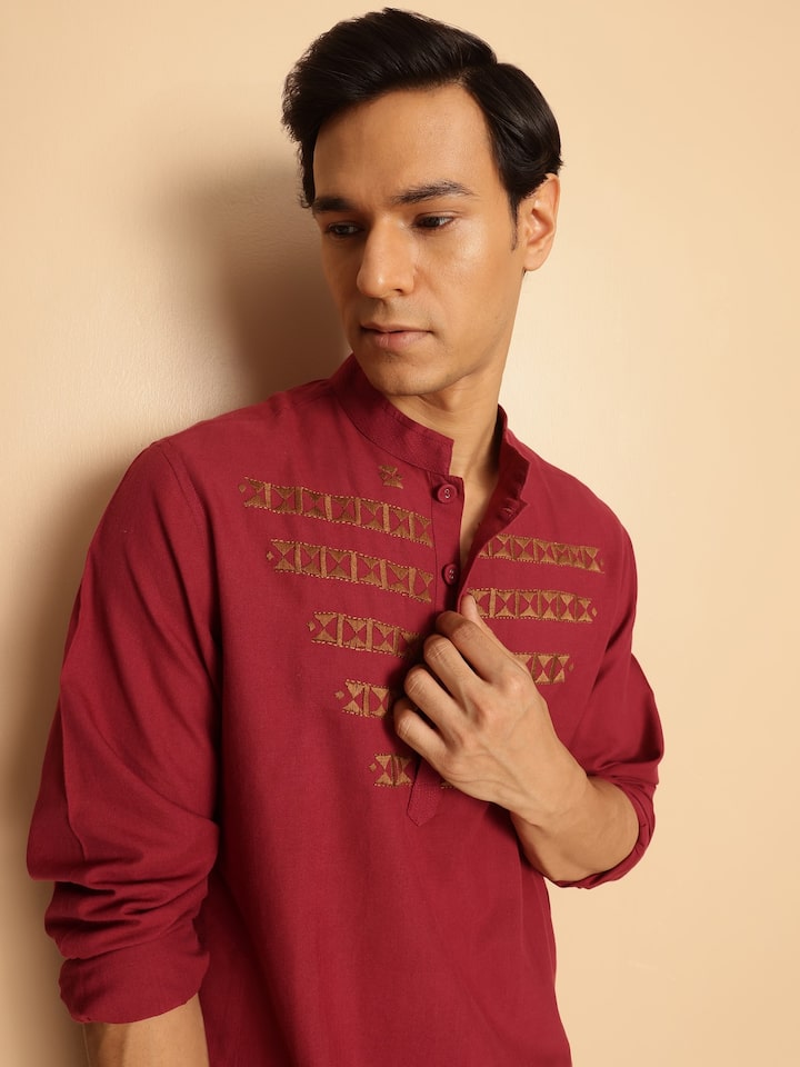 Close-up detail of cotton fabric and embroidery on kurta front and sleeves