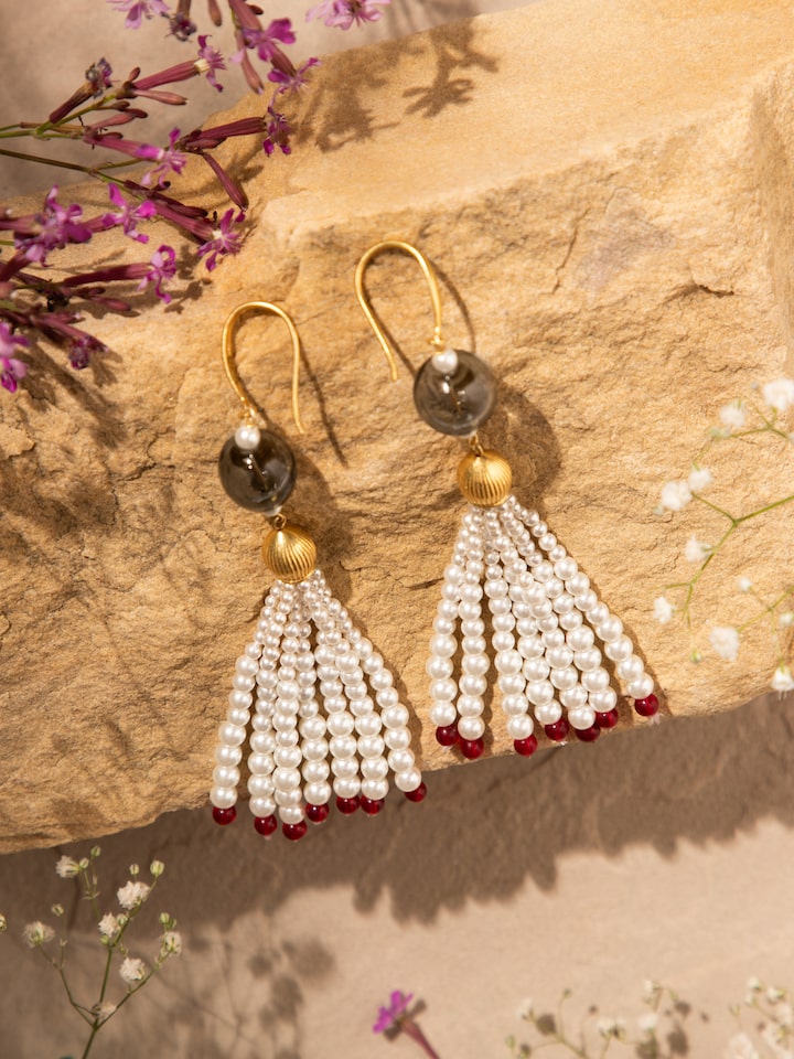 Angled view of Nakash Silver Drop Earrings emphasizing the graceful drop and intricate detailing