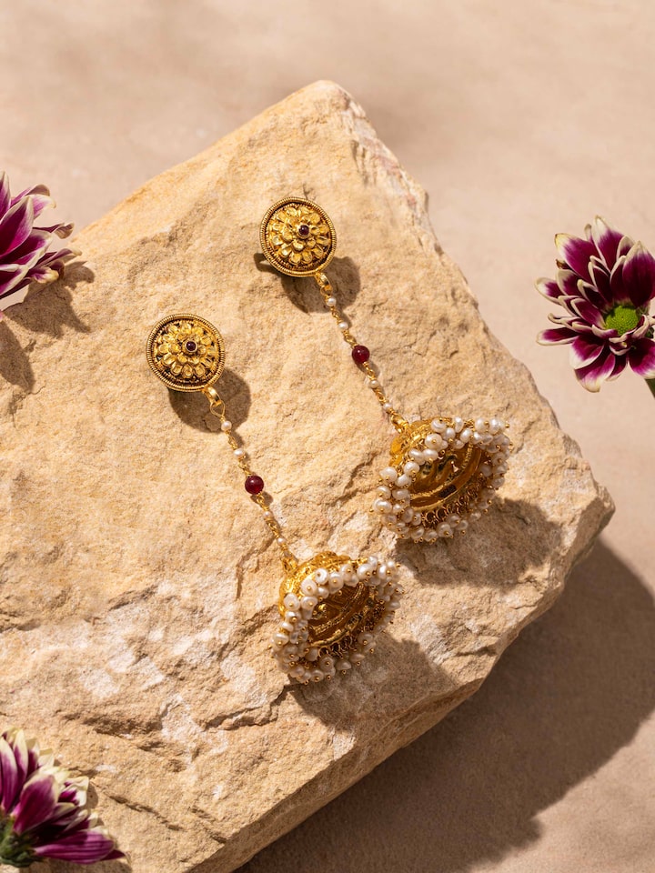 "Close-up of Nakash silver jhumka earrings showcasing detailed craftsmanship"